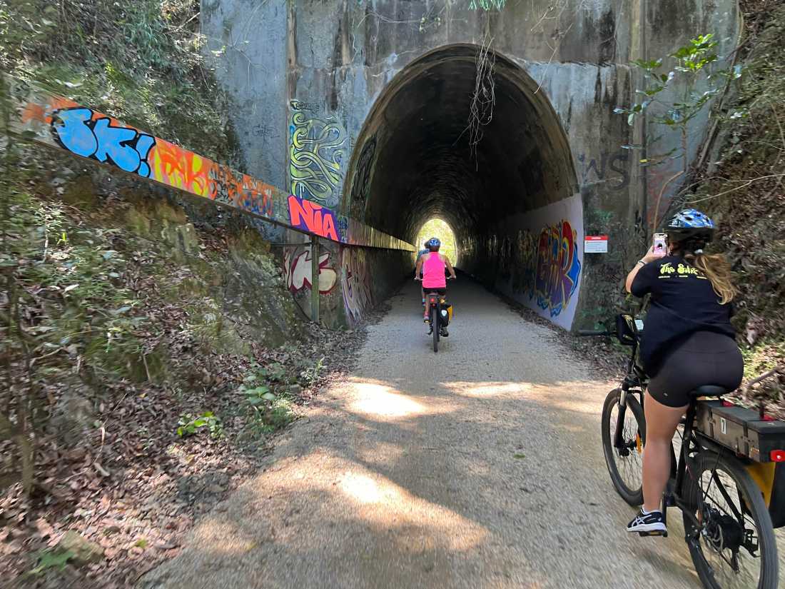 Cyclist entering tunnel on the northern rivers rail trail |  Kate Baker