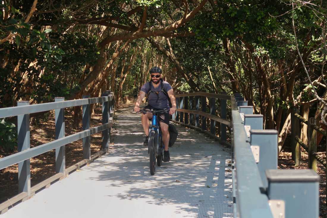 A cyclist on the Coastal Cycle Path between Pottsville and Kingscliff |  Erin Wileman