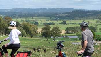 Taking the view between Bowral and Robertson,Kate Baker Cyclists taking in the view between Bowral and Robertson